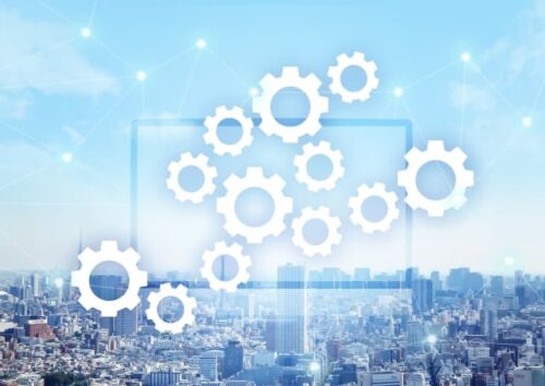 white-gears-representing-a-mental-system-with-a-cityscape-background